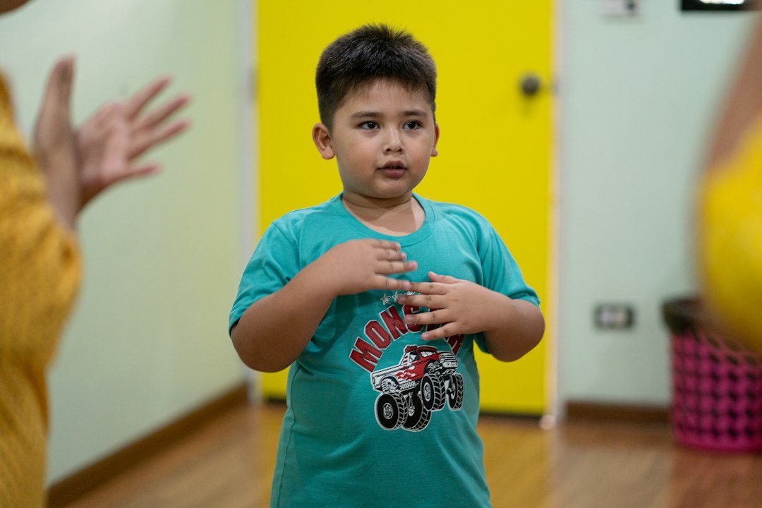 Young boy standing in a bright playroom