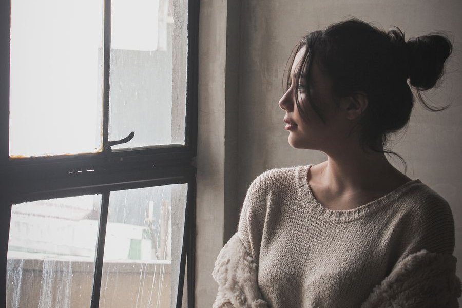 Woman looking out a window