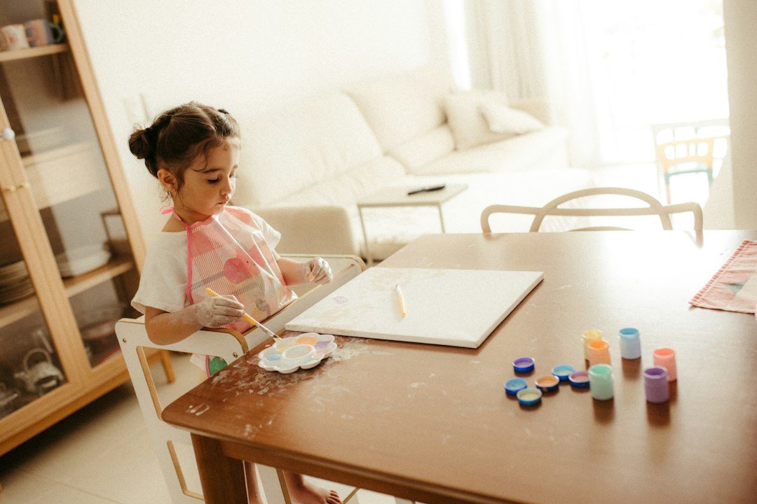 Young girl painting at a table