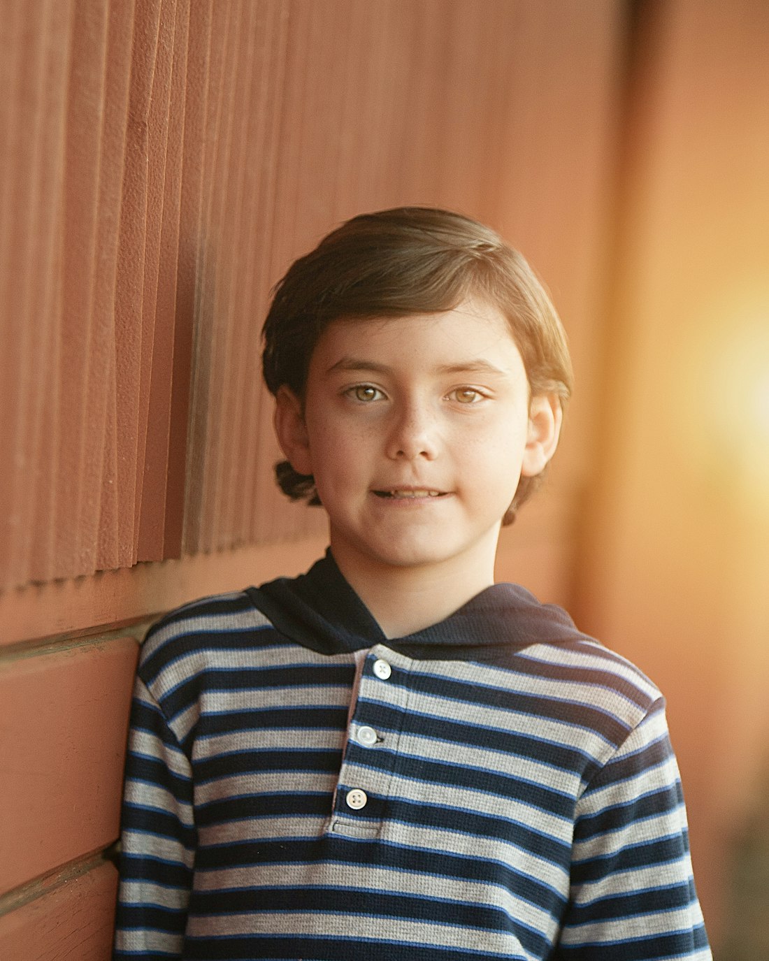 Boy in a striped shirt smiling